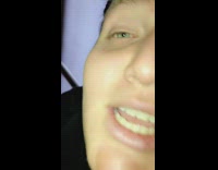 Slow motion video, close up of a guy moving his eyebrows to the beat of Funkytown song