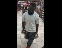 Man pours pennies on counter at gas station