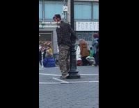 army pants man dance on light pole
