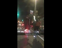 Three guys riding two bikes street night time