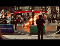 Firefighters hose down burning tree 