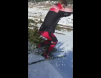 Red black jacket green skis guy fail 