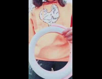 Skit of person recreating tiktok ring light trend with chicken