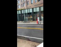 Guy films black car going over pothole