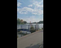 Excavator truck on a barge to cross the river