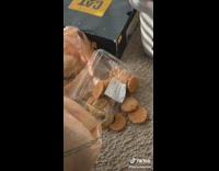 Baby gets cookies from box 