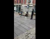 Girl poses with large scarf outside  