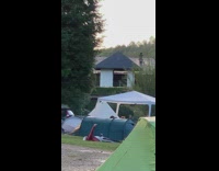 Red jacket guy lays back controls drone 