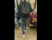 Guy dancing by shuffling feet left to right on subway