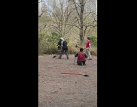 Two guys wearing knight costumes fight axes