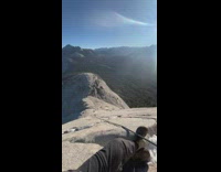 Man sit rest on ledge mountain climbing