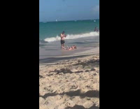 Guy takes photos for his girlfriend at the beach 