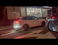 White car covered with chrismas lights night