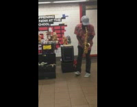 Man plays Careless Whisper on saxophone with dancing animal puppets in subway station