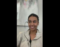 GIrl with floating hair on side of head