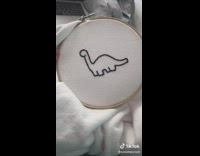 Collab BitchIG2 - Embroiderying dinosaurs onto matching white shirts 