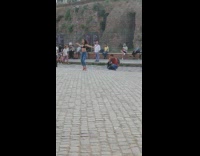 Woman in black crop top tiktok dance in the park