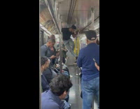 Guy show dance moves inside the train at NYC 