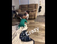Cat bites boy face while watching TV