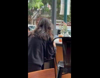 Woman takes picture and video of drink