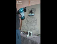 Guy creates baby portrait using screws screwdriver 