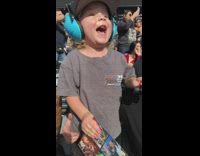 Little boy cheers for his favorite monster truck 