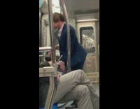 man blue blazer singing in train