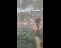 Girl grey beanie black ears selfie in hot springs 