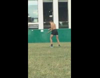 Shirtless guy black shorts dances tripod construction 