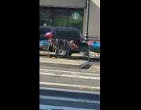 Guy pulls ten shopping carts tied together 