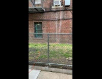 Collab WINY - Electric car charger connected to high building room brick wall