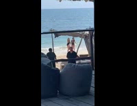 Jumping pose at beach black bikini   
