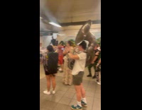 People listen to orchestra band in subway