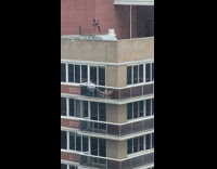 Man in underwear photoshoot on roof