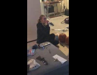 Friends carve pumpkins guy sits pants down