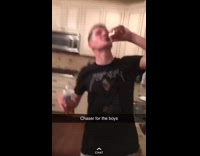 Guy takes a swig out of water bottle and chases it with Tabasco hot sauce