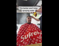 Client gets annoyed barber keeps spraying water