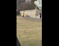 Black shirt girl dances pink hula hoop