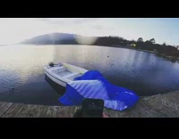 Guy blue parachute lands on wood dock