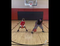 Dad and daughter practice basketball skills 
