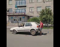 Strong man lift and rotate white car