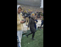Football player hugs after game 