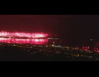 Red fireworks light up night sky celebration