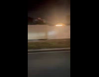 Woman reacts at Jeep covered with lights