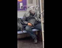 Man sleep in train silver vines headdress