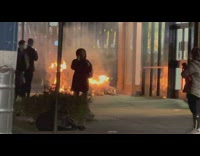 Pile of debris burns on sidewalk then explosion