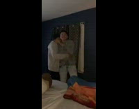 Guy throws pillow girl in bed news