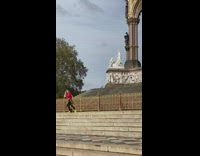 Woman red top dance stairs Albert Memorial