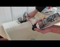 Guy freezes water using compressed air can