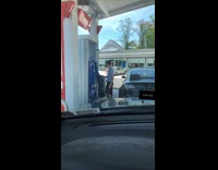 Tesla at gas station